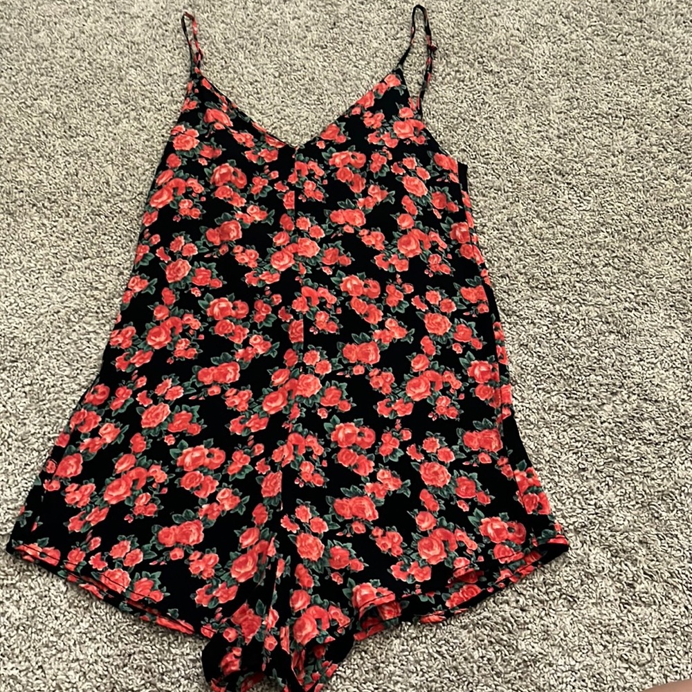 Red and black floral romper. Brand: Privacy Please. From Revolve